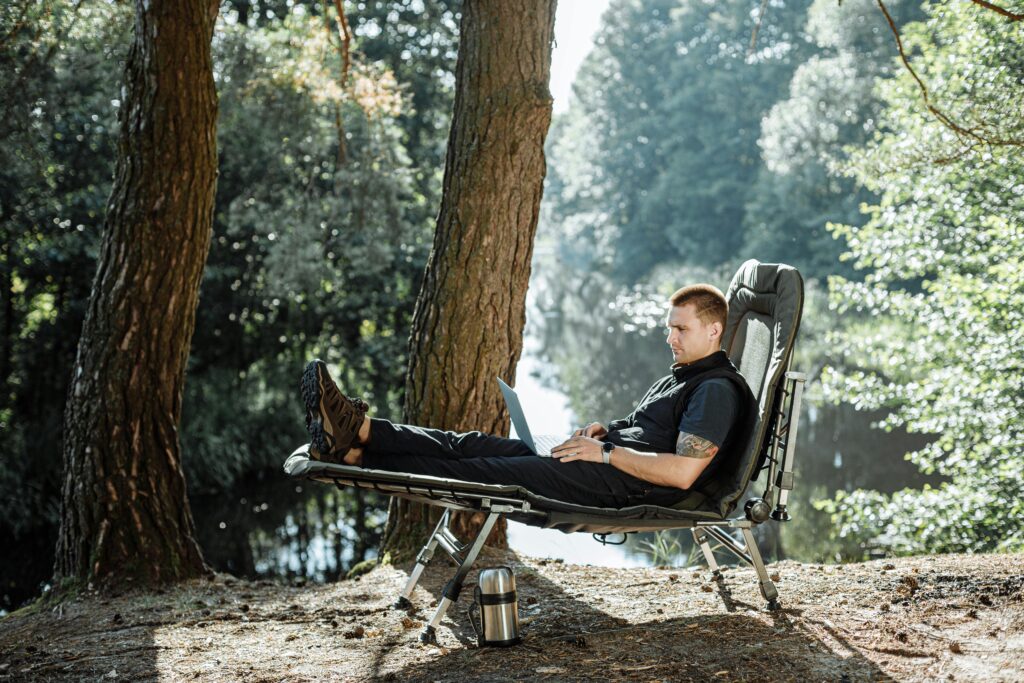 person sitting on camping cot