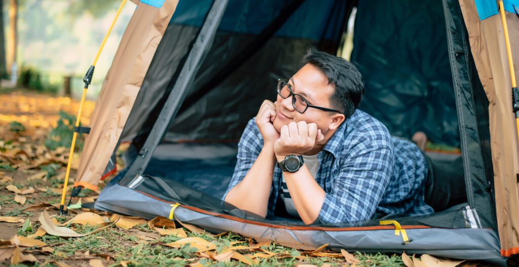 person sitting in tent